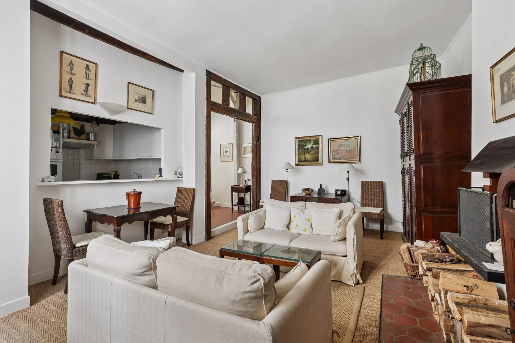 Characterful Latin Quarter living room with working fireplace and exposed timbers