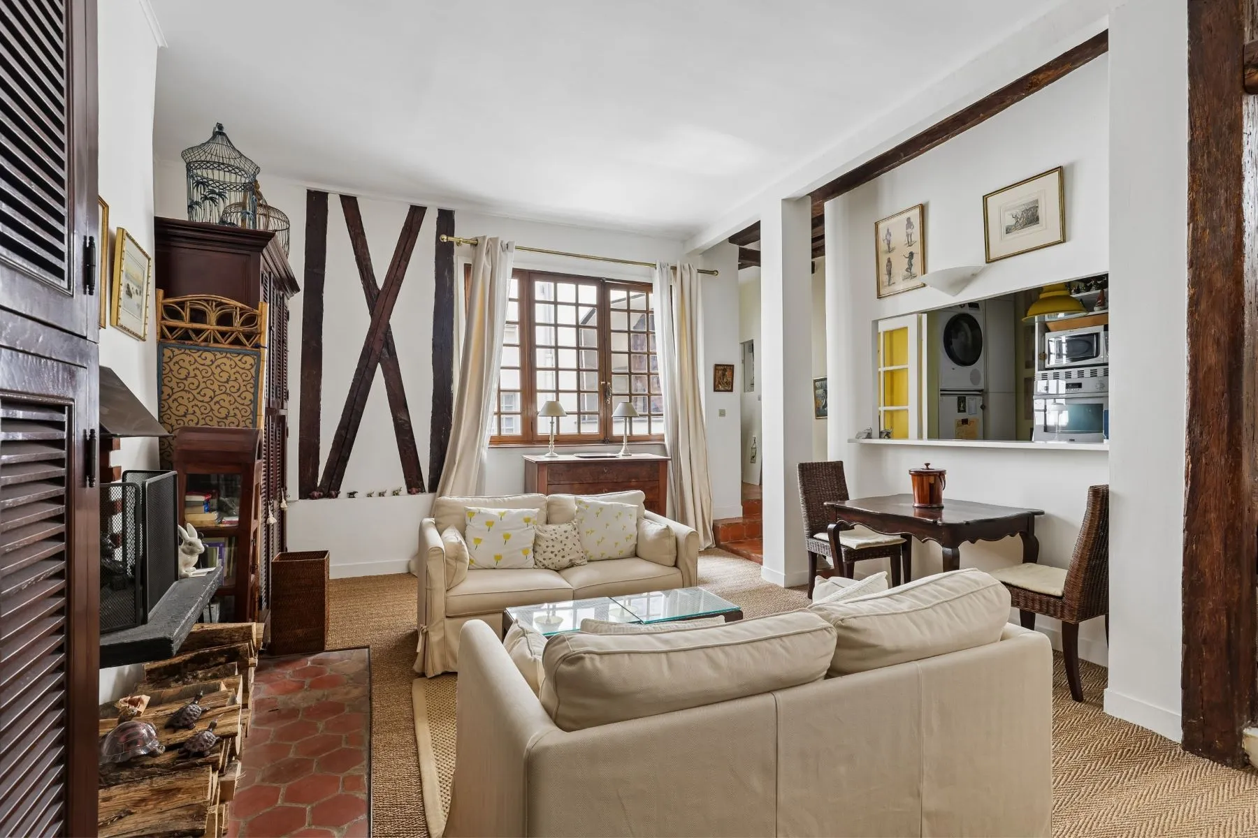 Historic Paris apartment interior with fireplace and half-timber details
