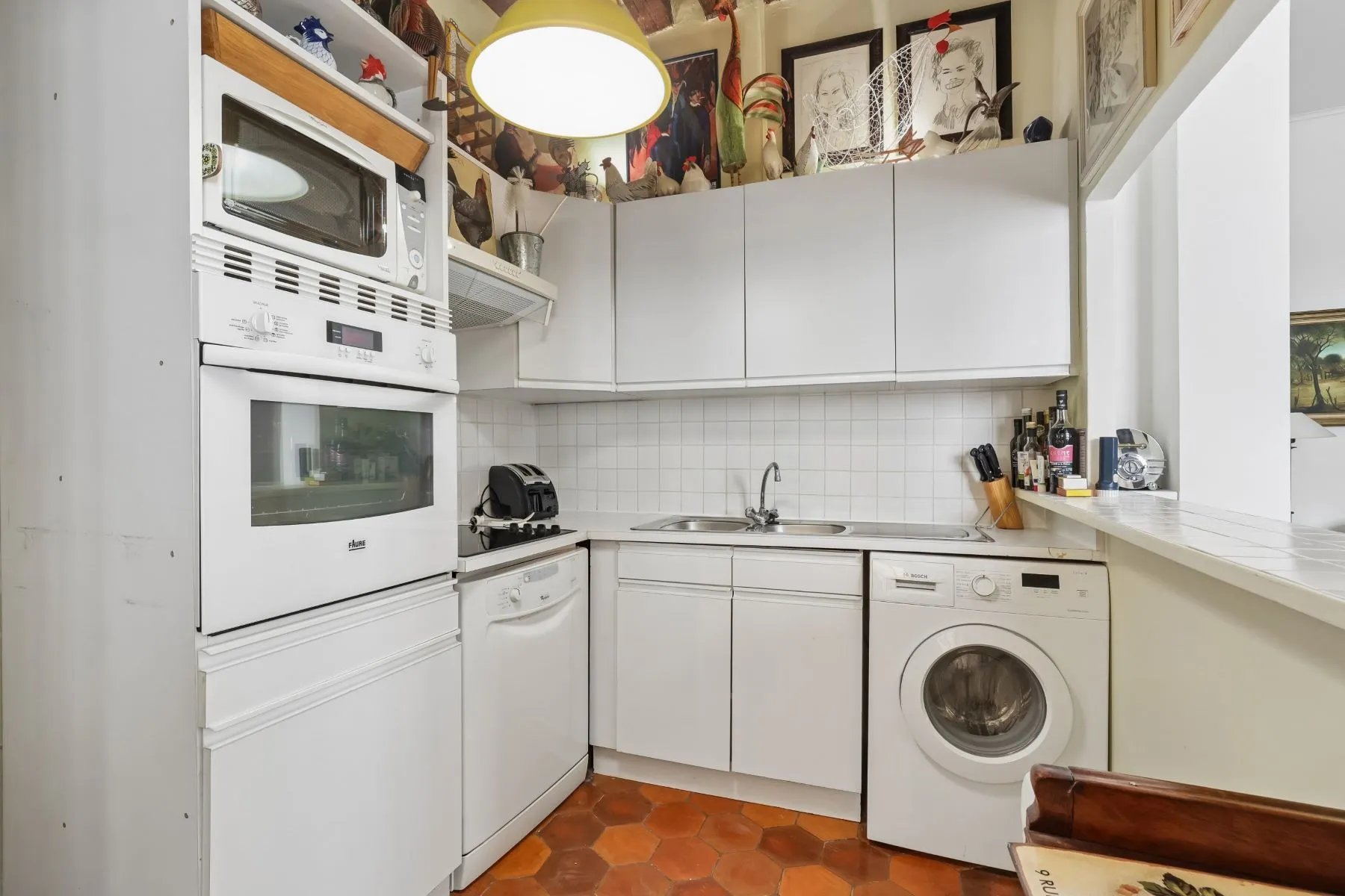 Fully fitted kitchenette with oven microwave and practical storage