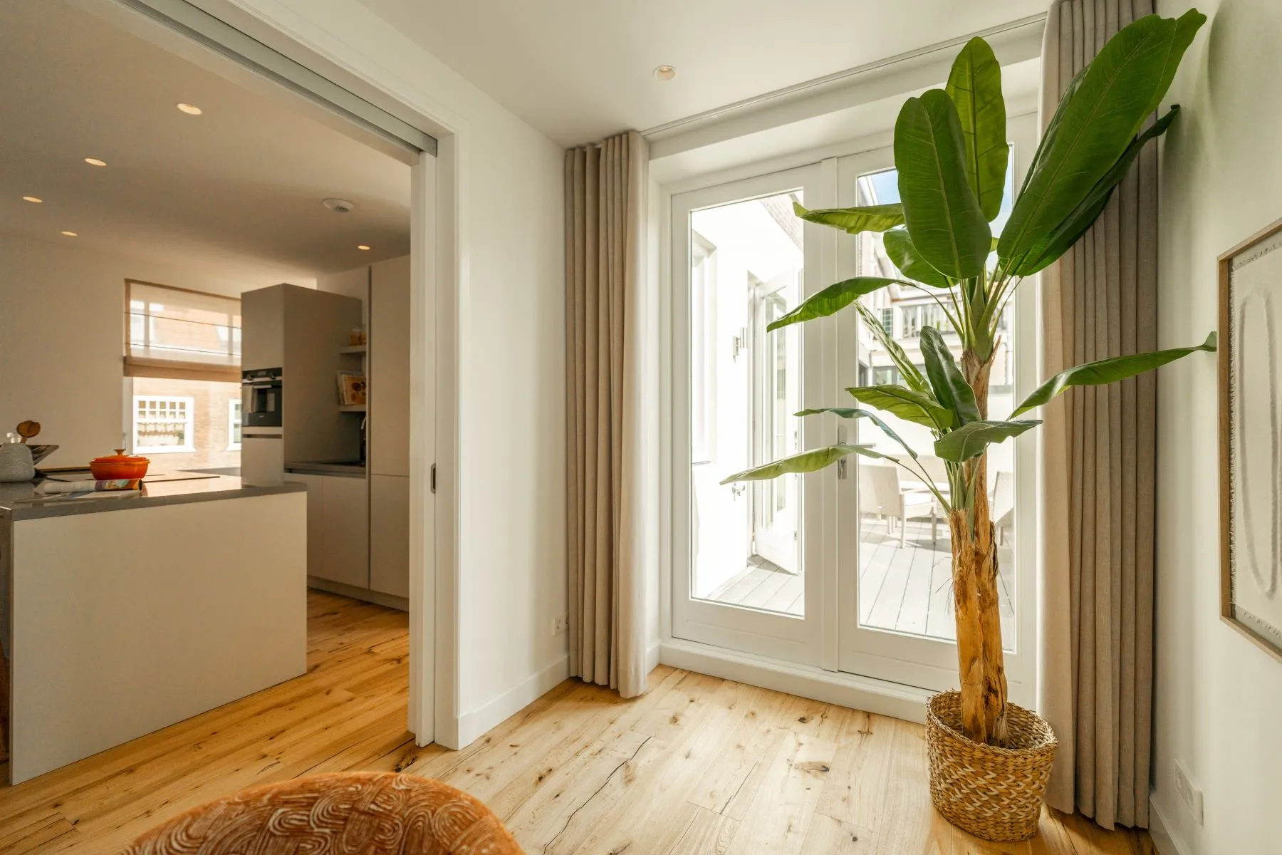 Bright multipurpose room connecting to the open-plan kitchen