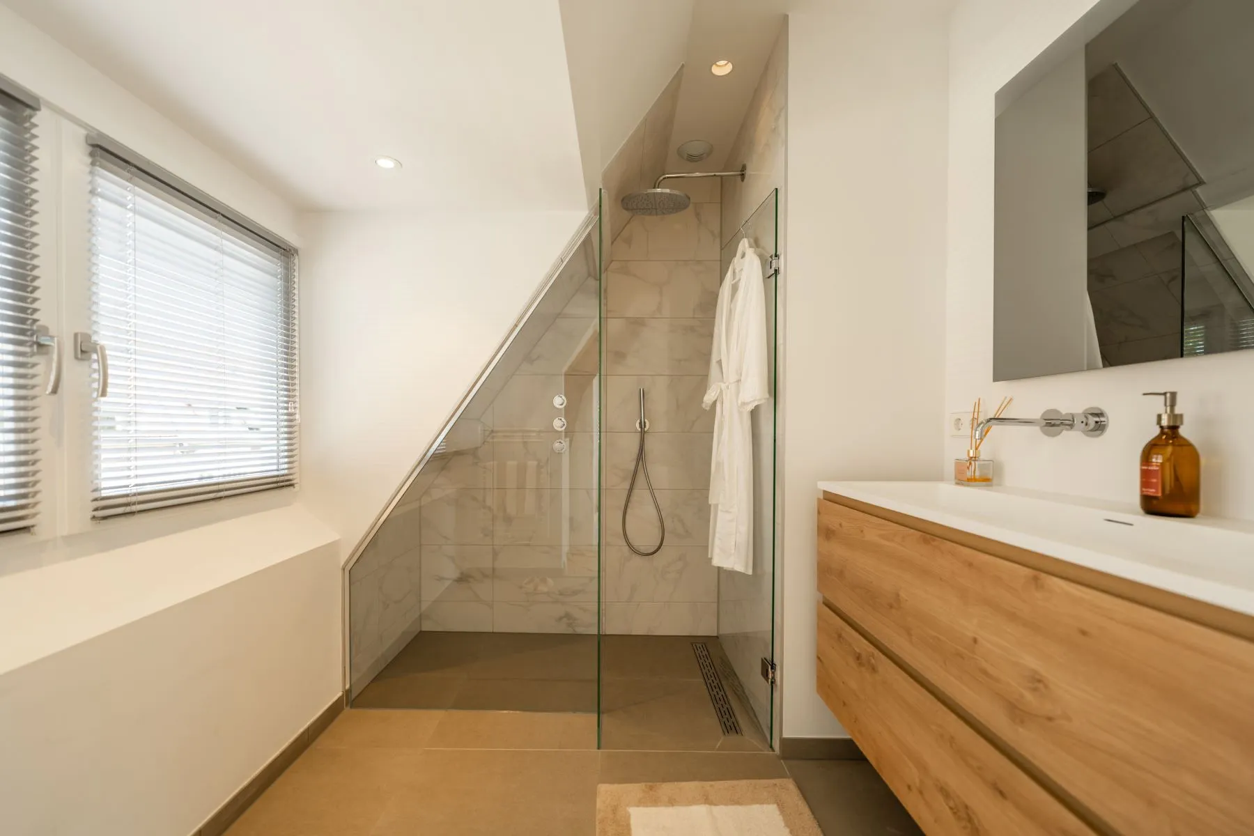 Contemporary en-suite bathroom with walk-in shower and timber vanity