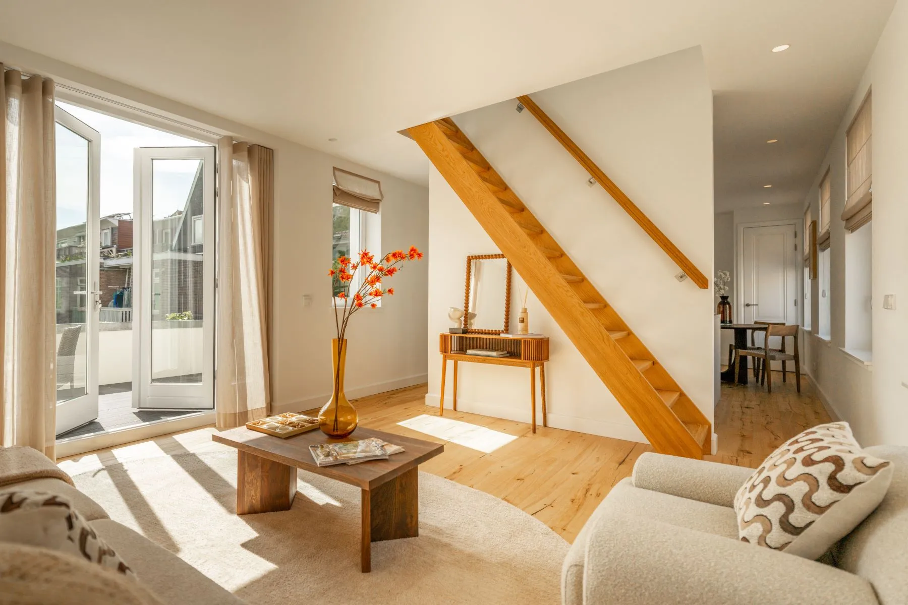 Sunlit duplex lounge opening directly to a private terrace