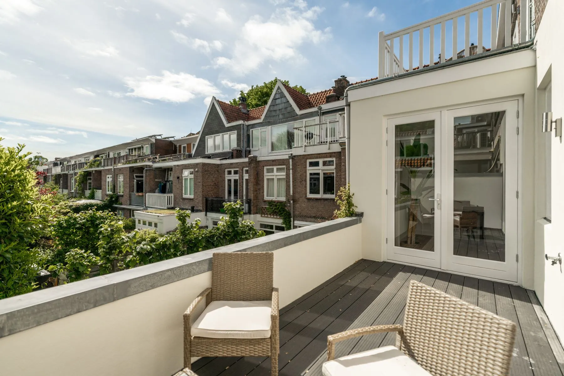 First private terrace with outdoor lounge seating and rooftop outlook