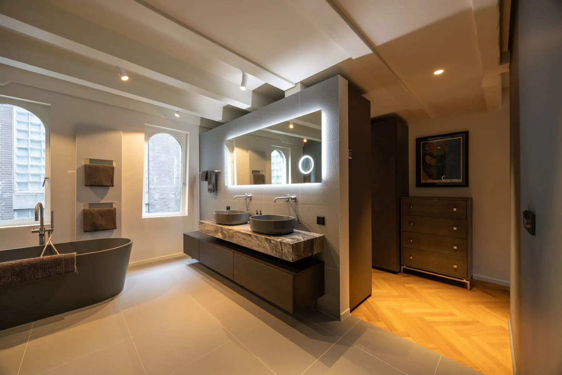 Illuminated double vanity within the principal en-suite bathroom