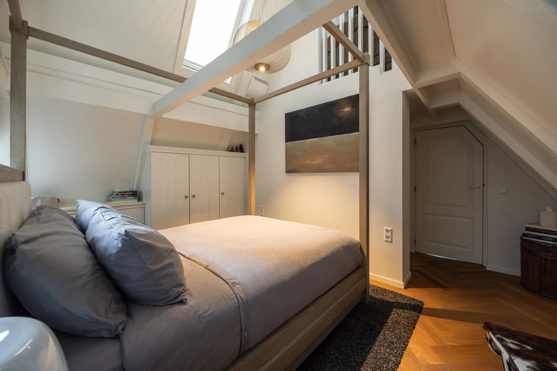 Comfortable third bedroom with fitted storage and roof-level light