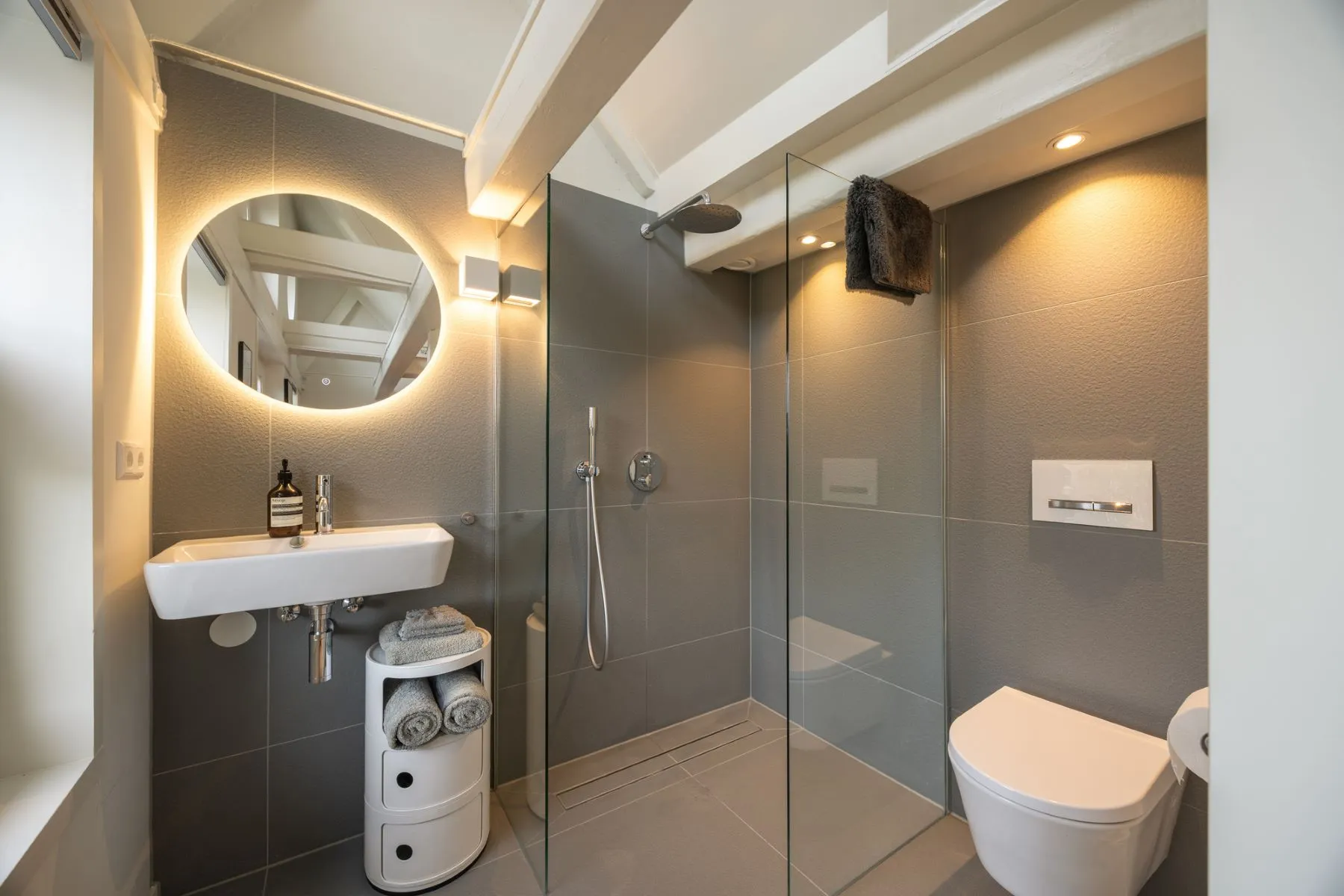 Contemporary third bathroom with walk-in shower and round mirror