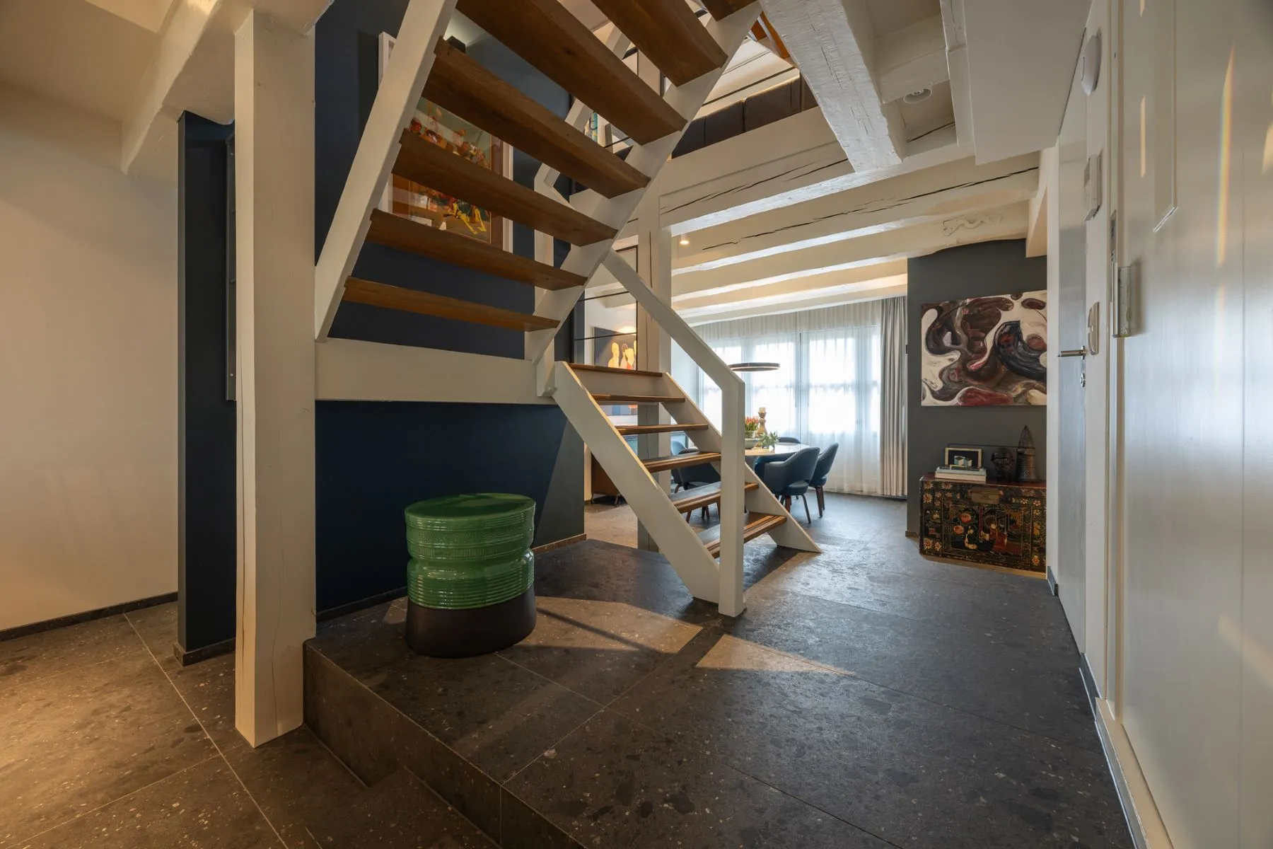 Ground-floor hall and open timber staircase inside the canal house