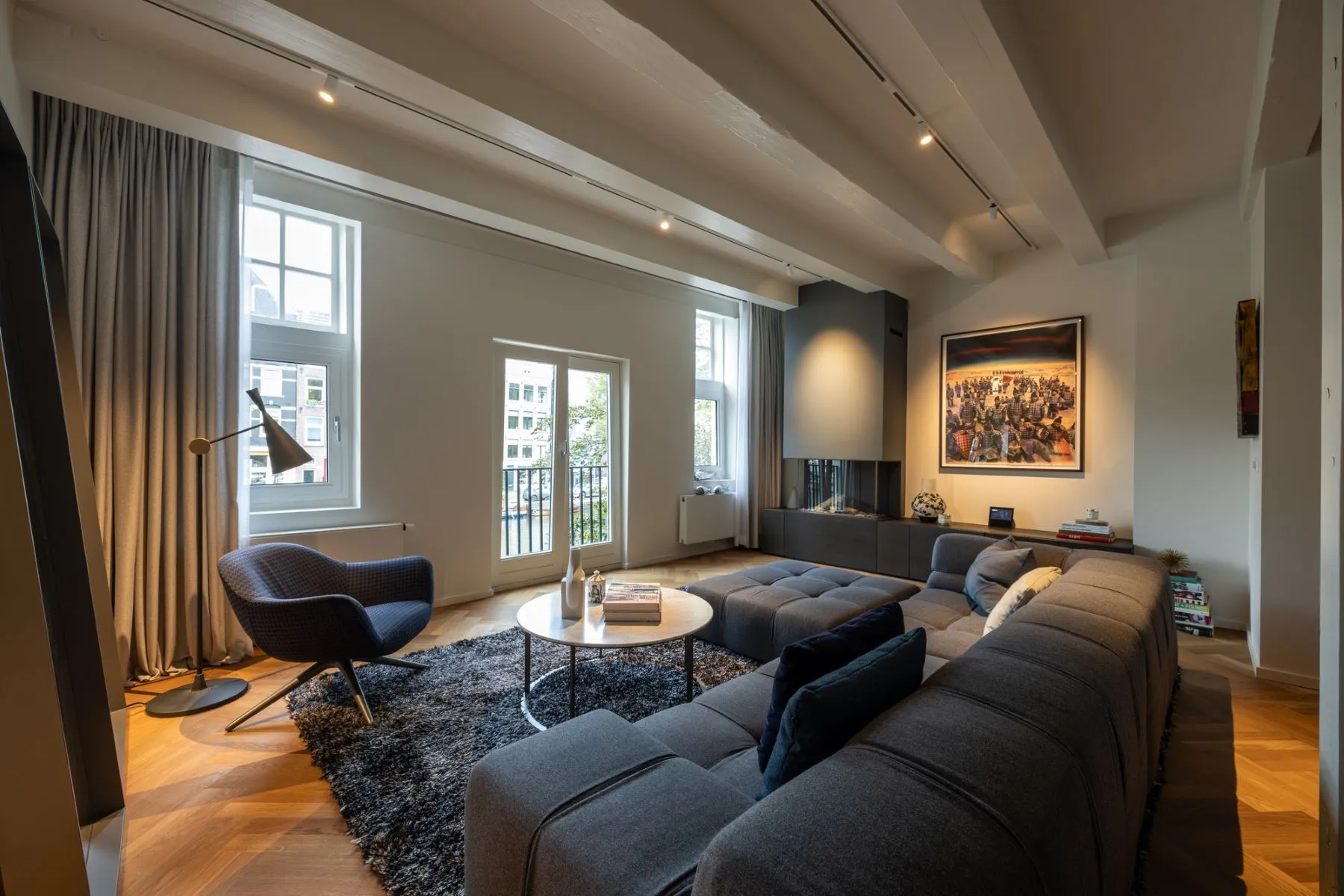 Sophisticated first-floor lounge with canal-facing French doors