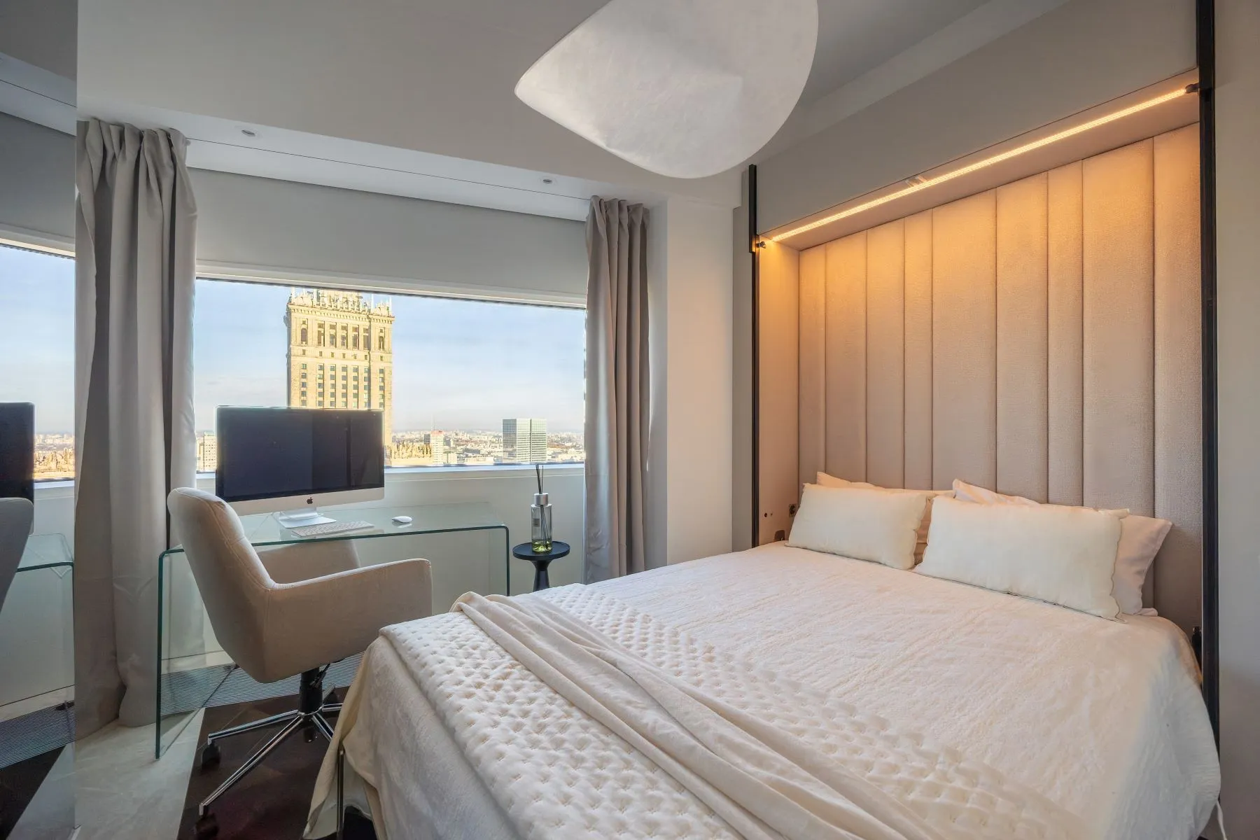 Second double bedroom with upholstered headboard and window-side workstation