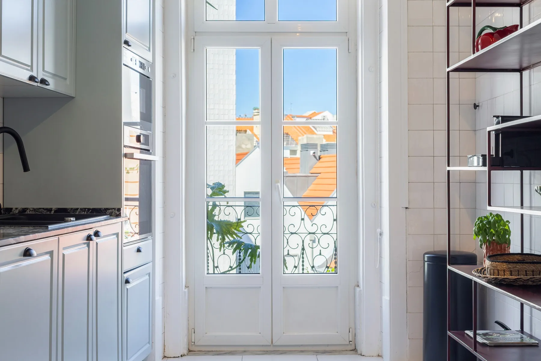 Kitchen balcony doors bringing natural light into the cooking space