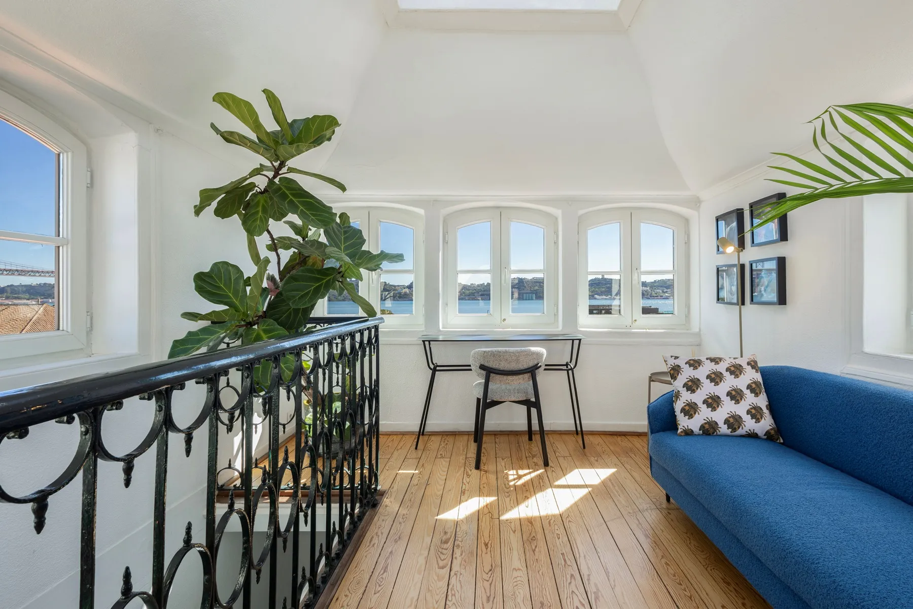 Panoramic turret lounge surrounded by windows above Lisbon