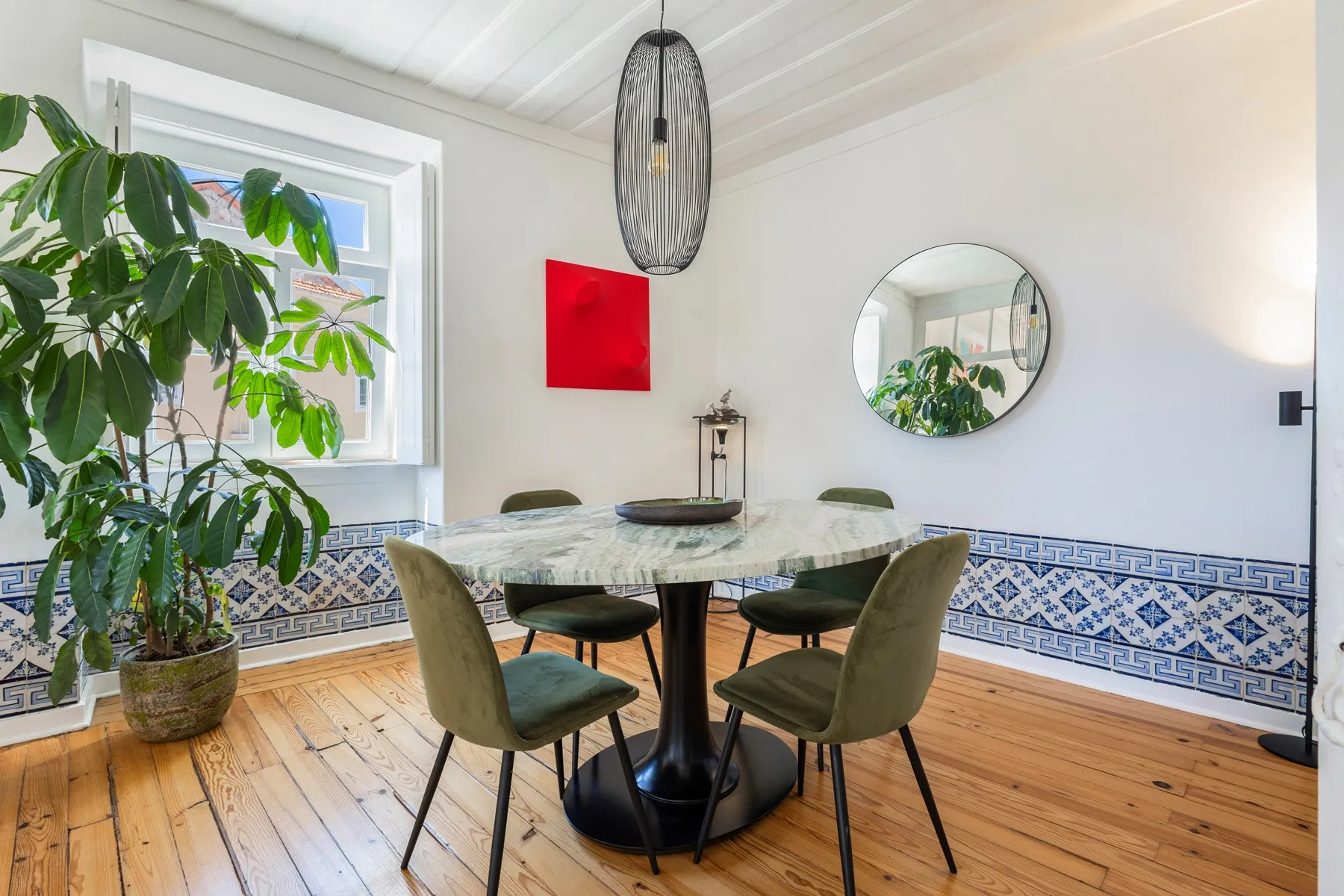 Separate dining room with patterned tile bench and garden plants