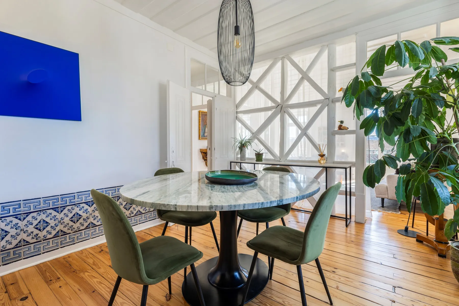 Dining room connecting to the decorative glazed reception partition