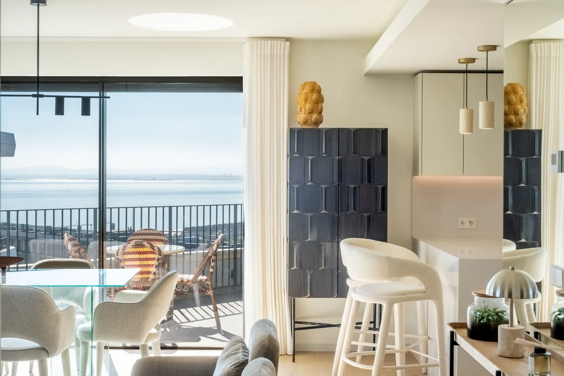 Kitchen breakfast bar opening to the panoramic private terrace