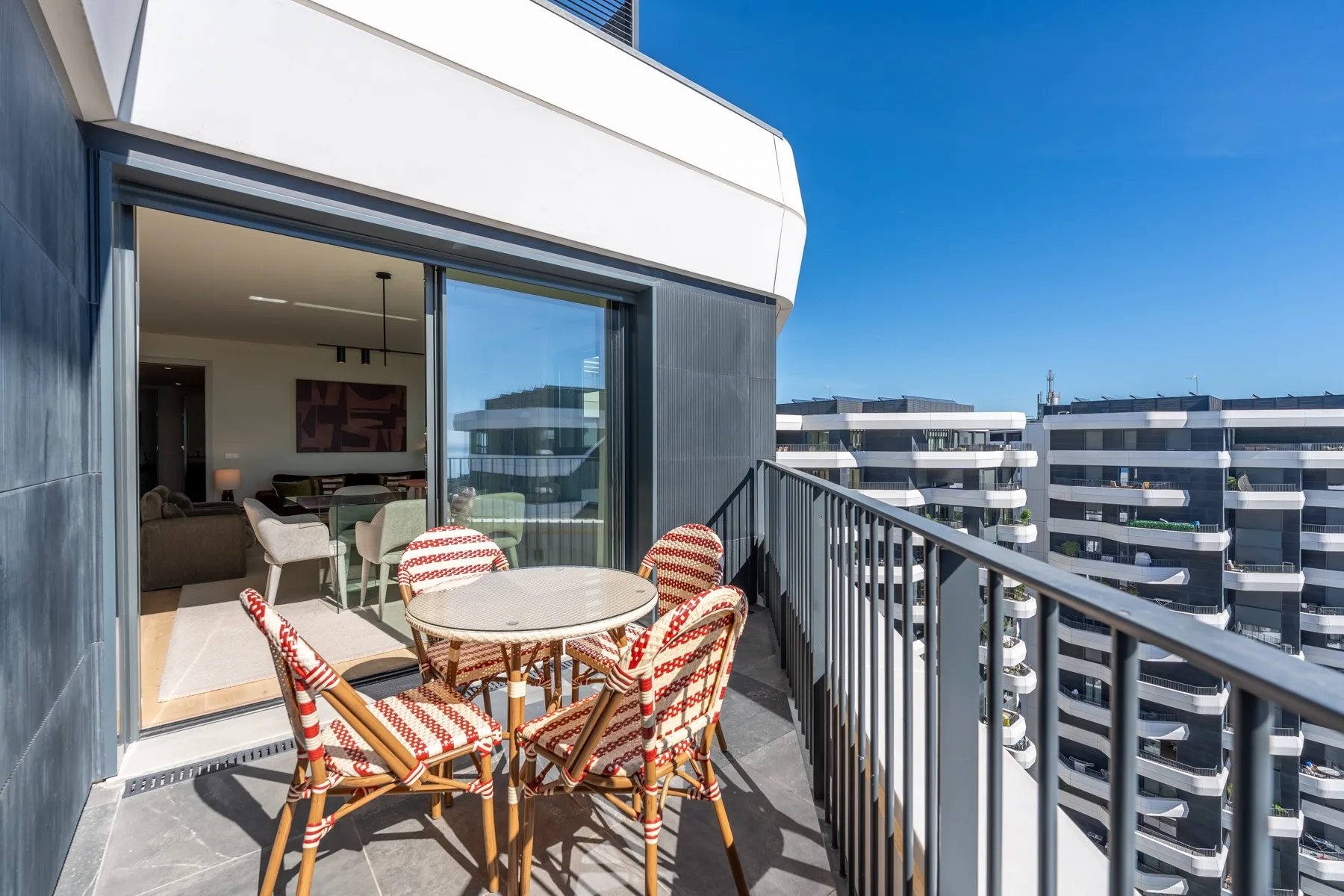 Outdoor dining table on the sheltered penthouse balcony