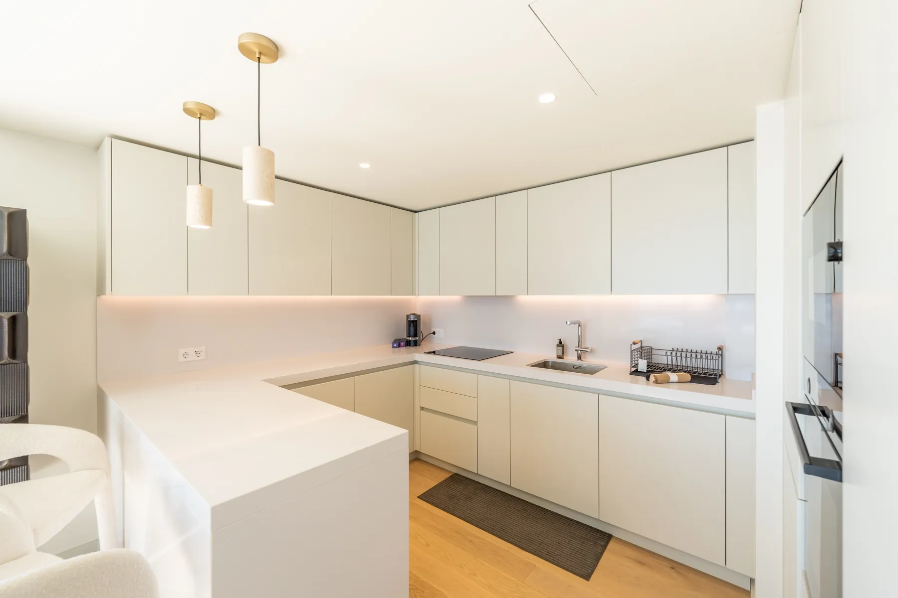 Modern pale kitchen with generous worktop and breakfast seating