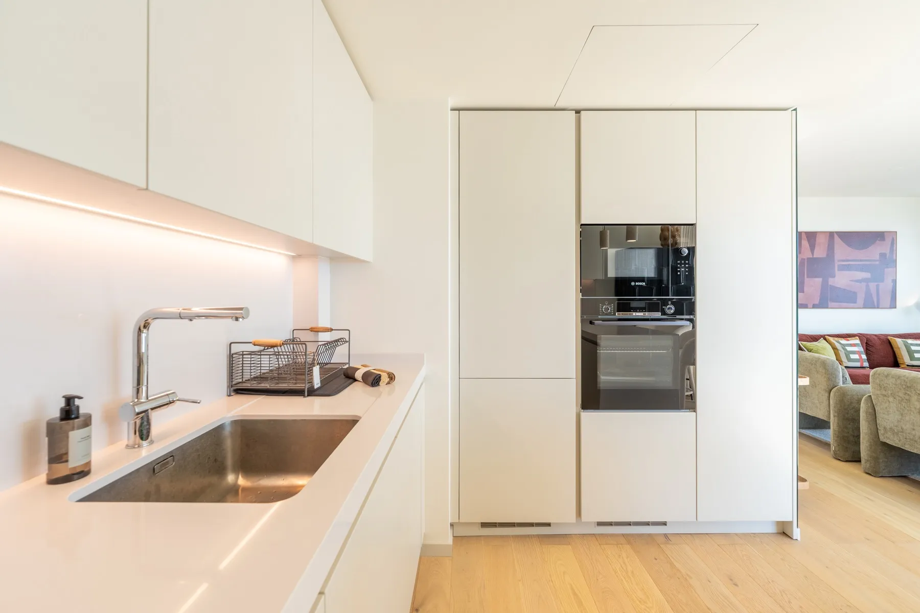 Integrated oven refrigerator and preparation area in the fitted kitchen
