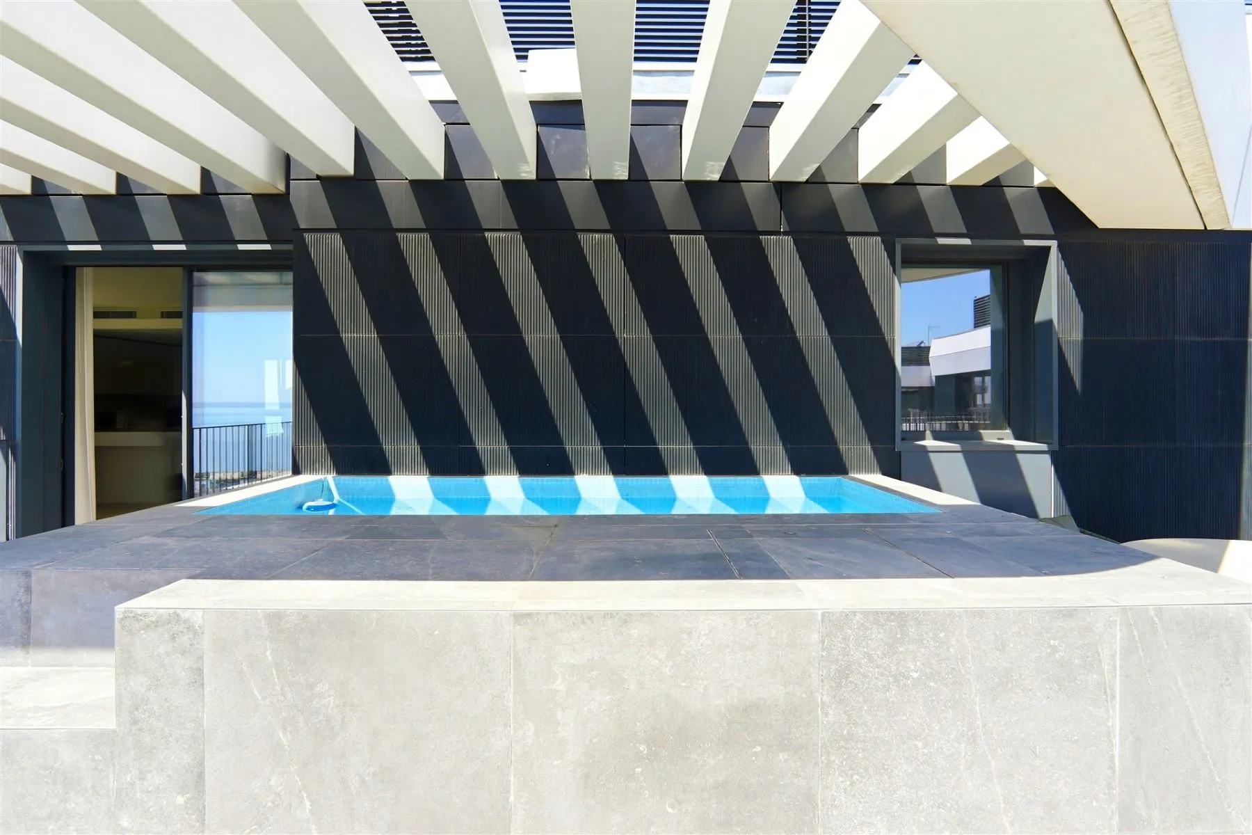 Heated private pool beneath the penthouse pergola