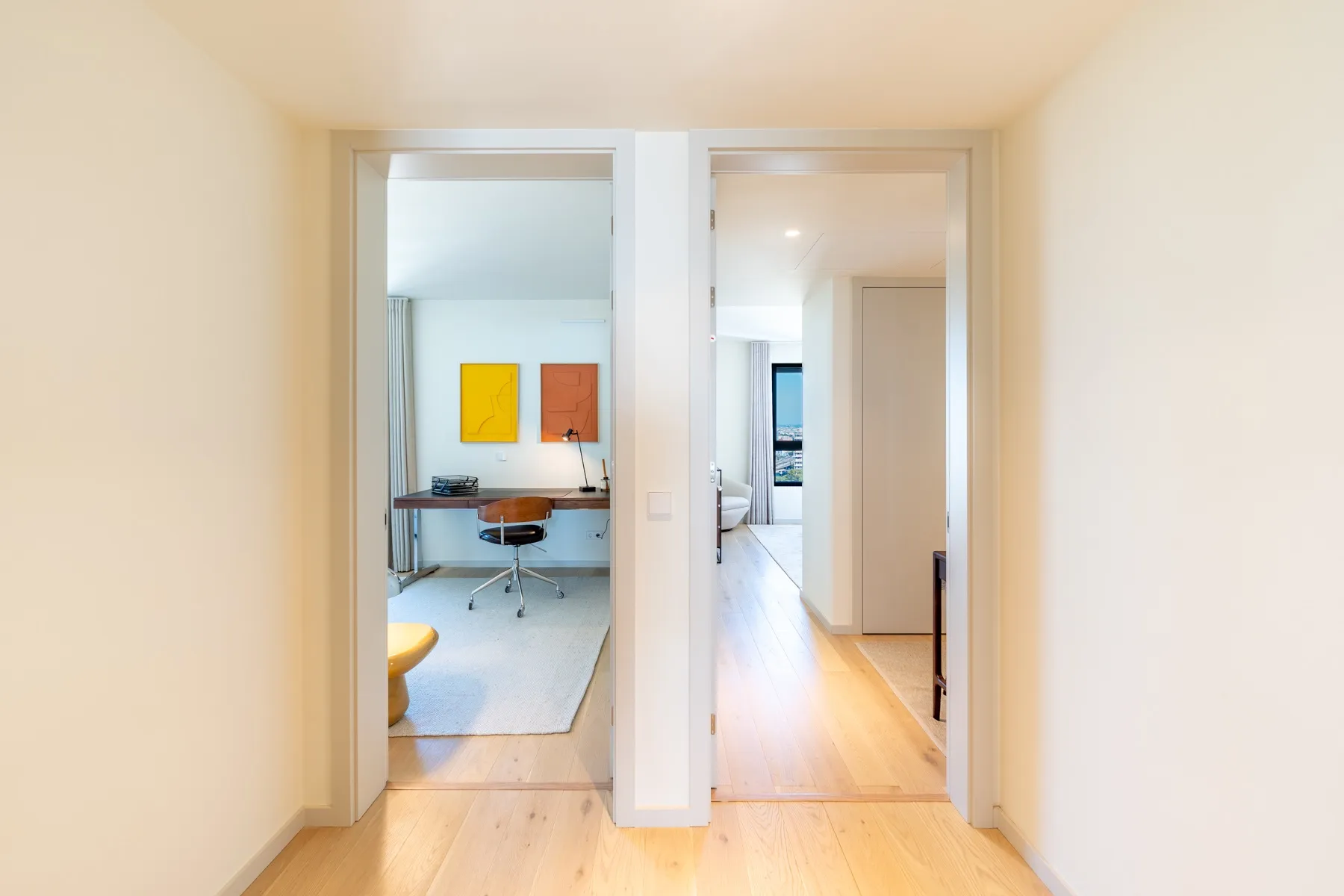 Bright private hallway connecting the bedrooms and reception area