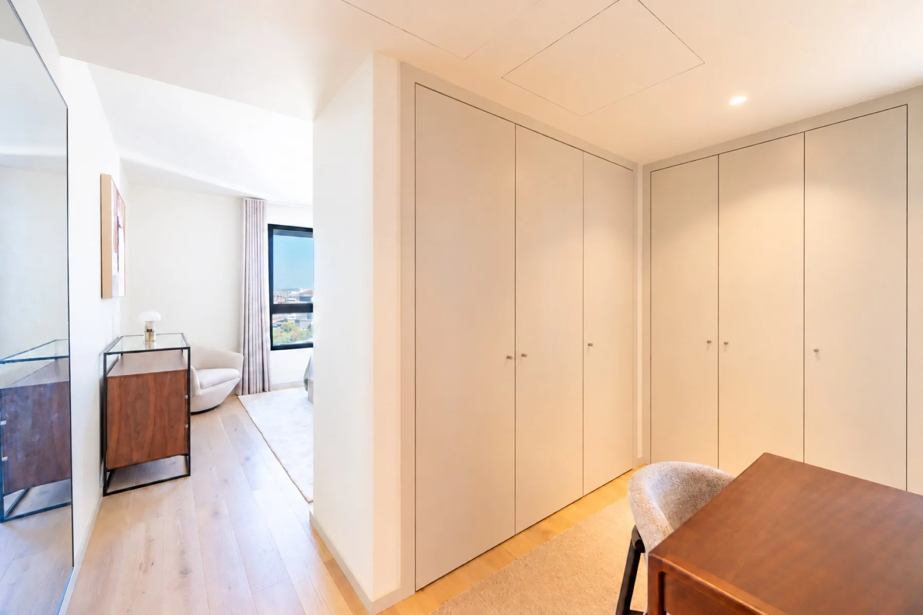Principal suite entrance with extensive fitted wardrobe storage
