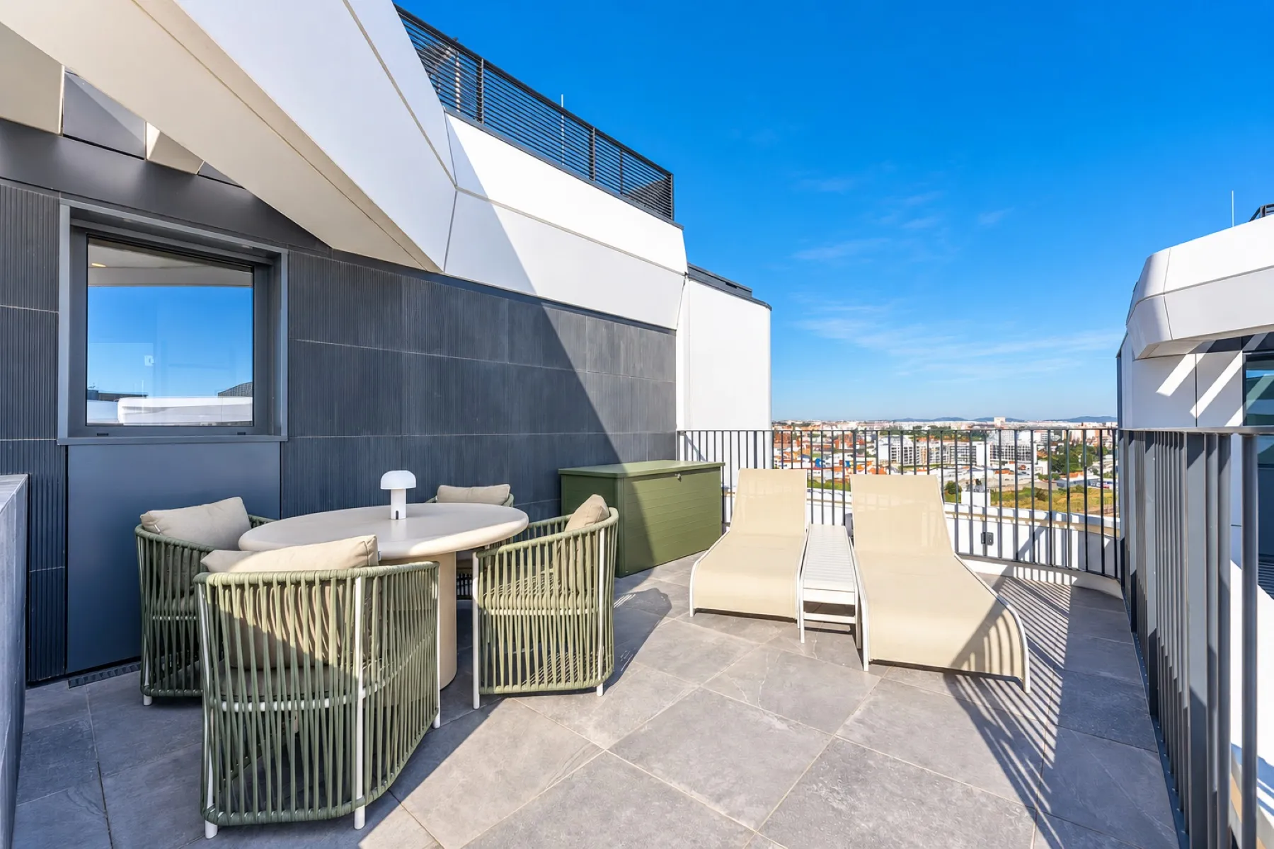 Expansive private terrace with outdoor dining beside the pool