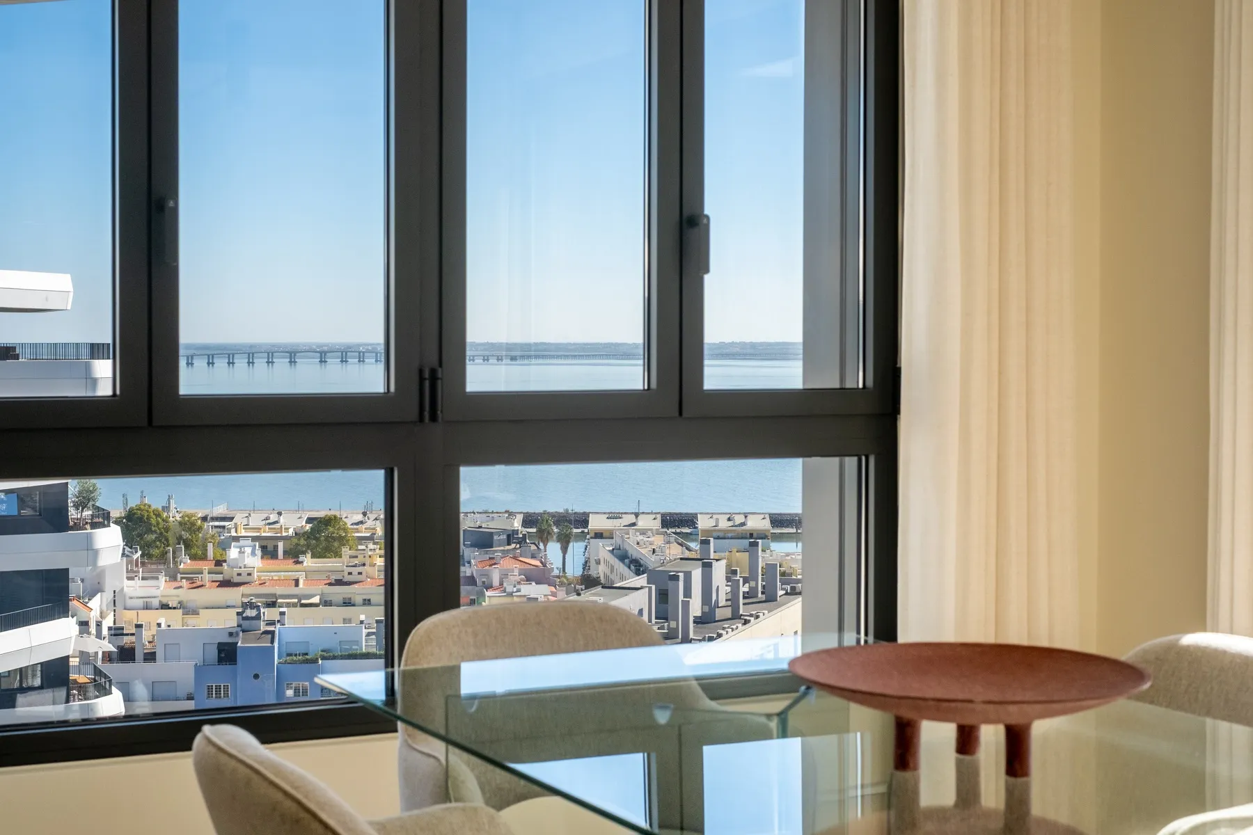 Window-side seating with elevated views across Parque das Nações
