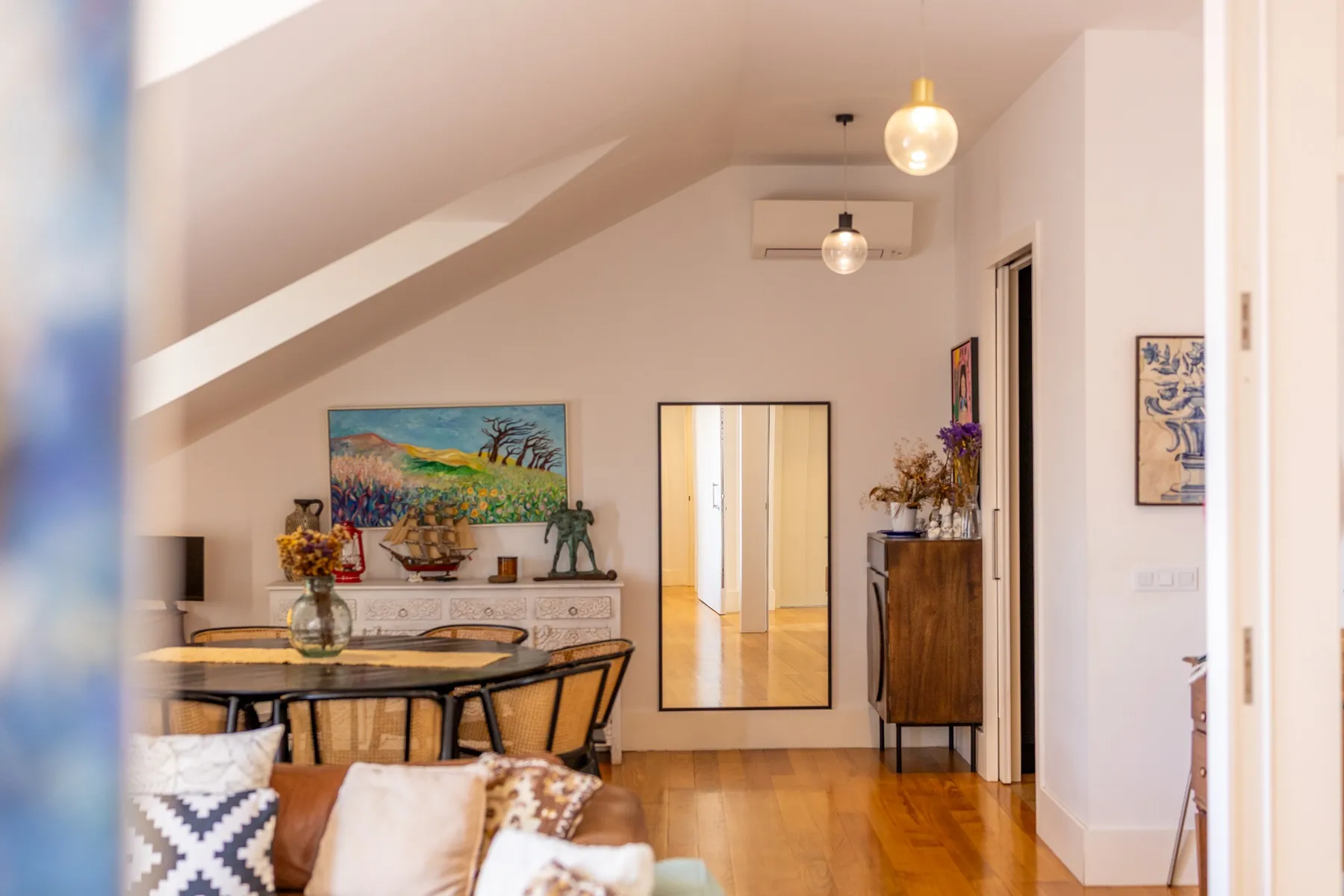 Kitchen dining corner with artwork and natural light
