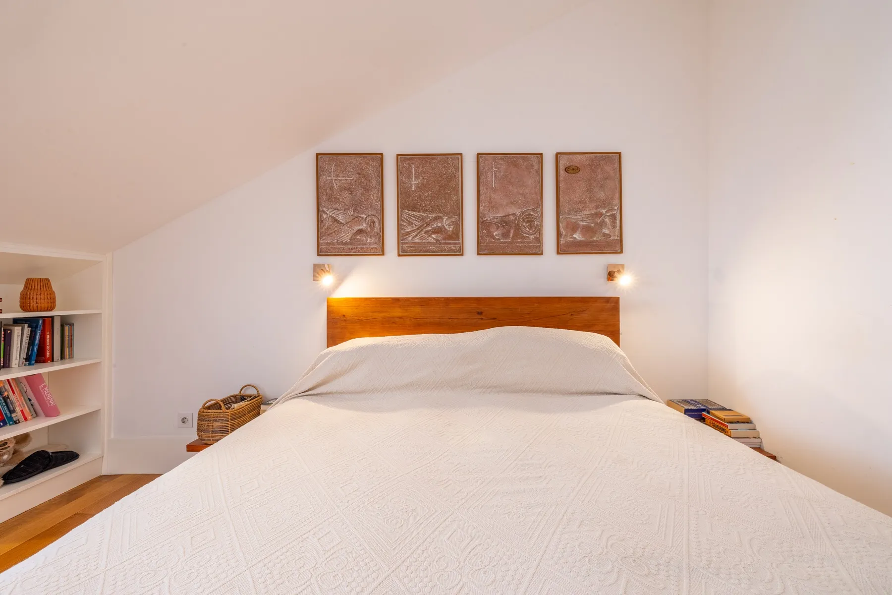 Restful principal bedroom with timber headboard and integrated lighting