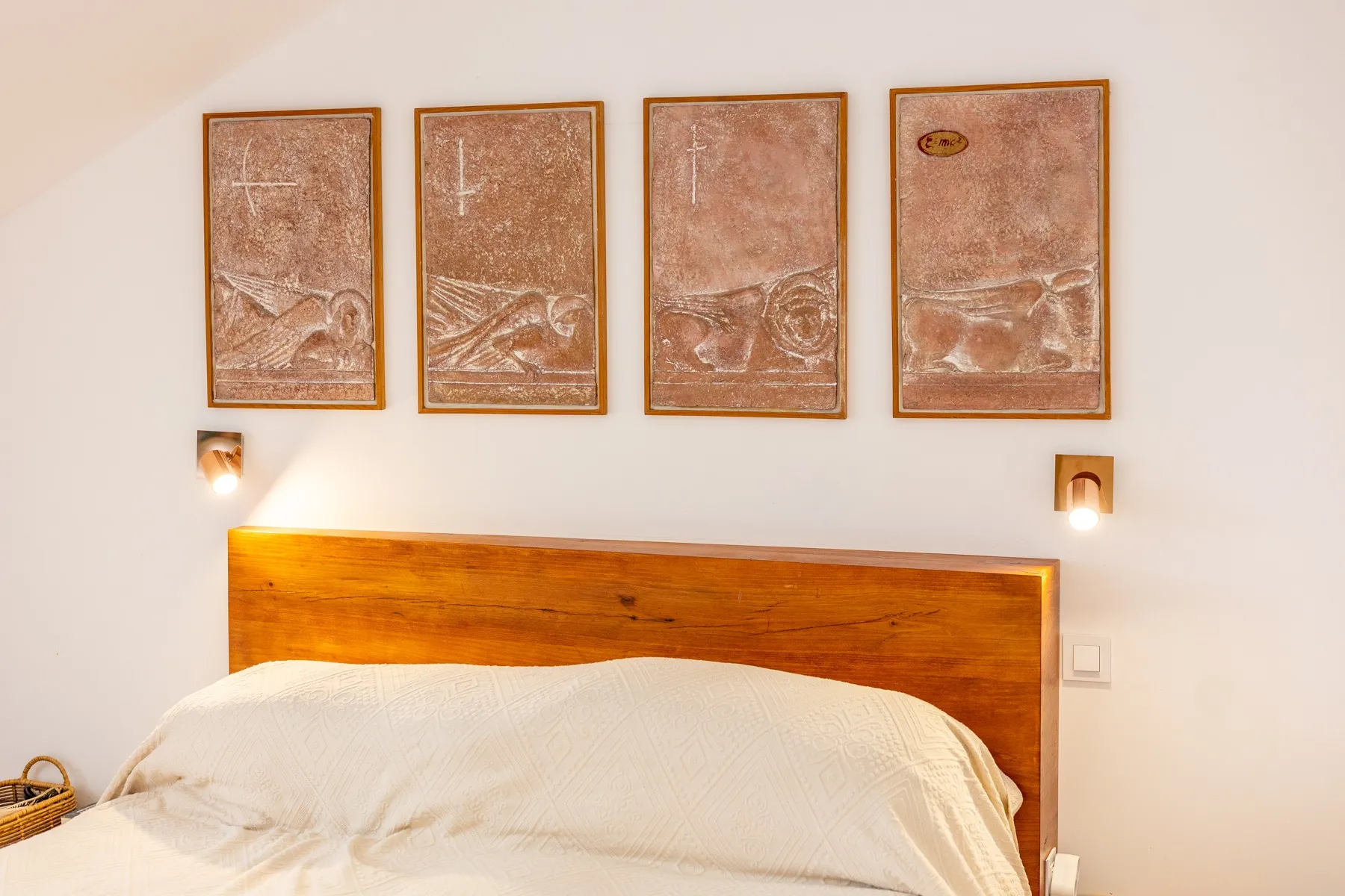 Close view of the principal bed and decorative wall artwork