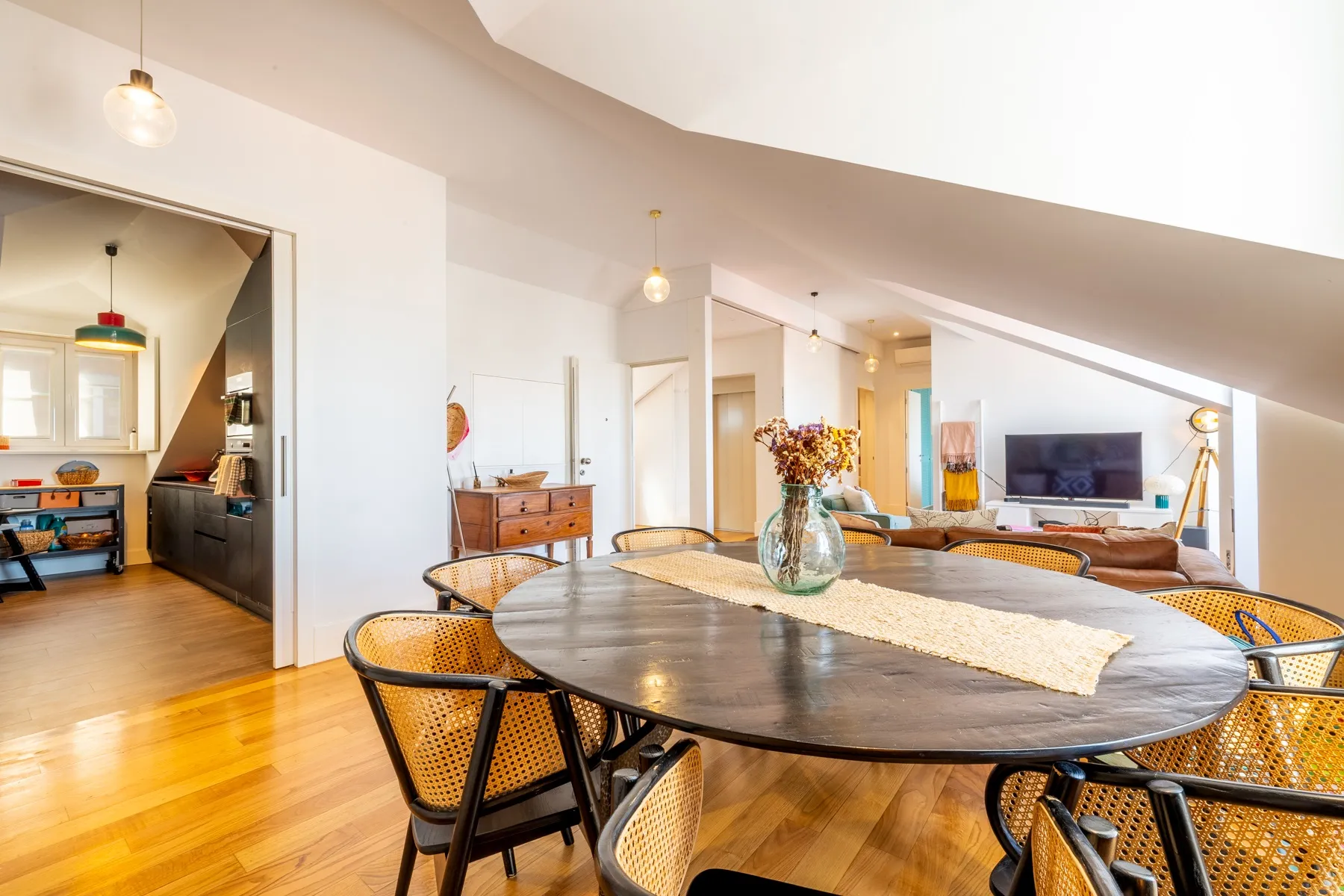 Round marble dining table beside the bright Lisbon reception area