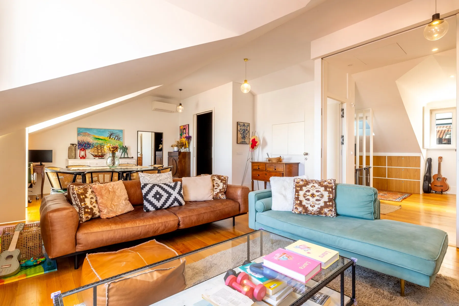 Comfortable main living area with sofa seating and contemporary art