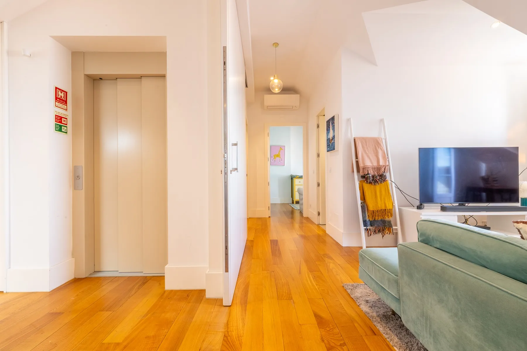 Apartment entrance hall connecting the kitchen and open reception room