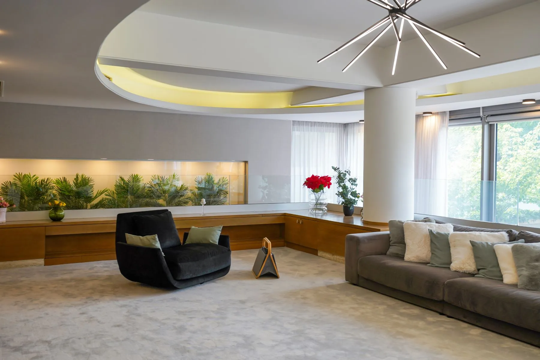 Elegant living area with long timber console and panoramic windows