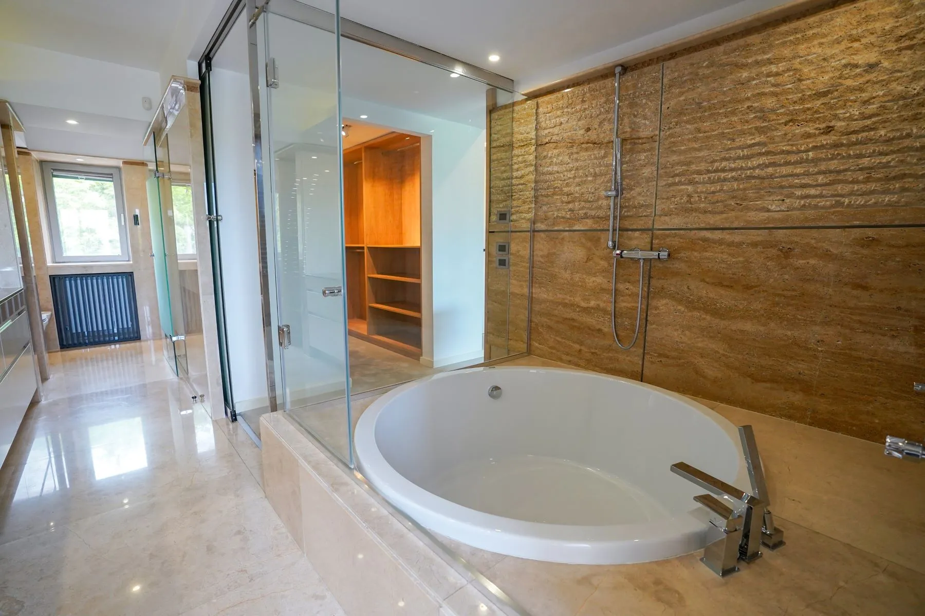 Spa-style bathroom with freestanding bathtub and separate walk-in shower