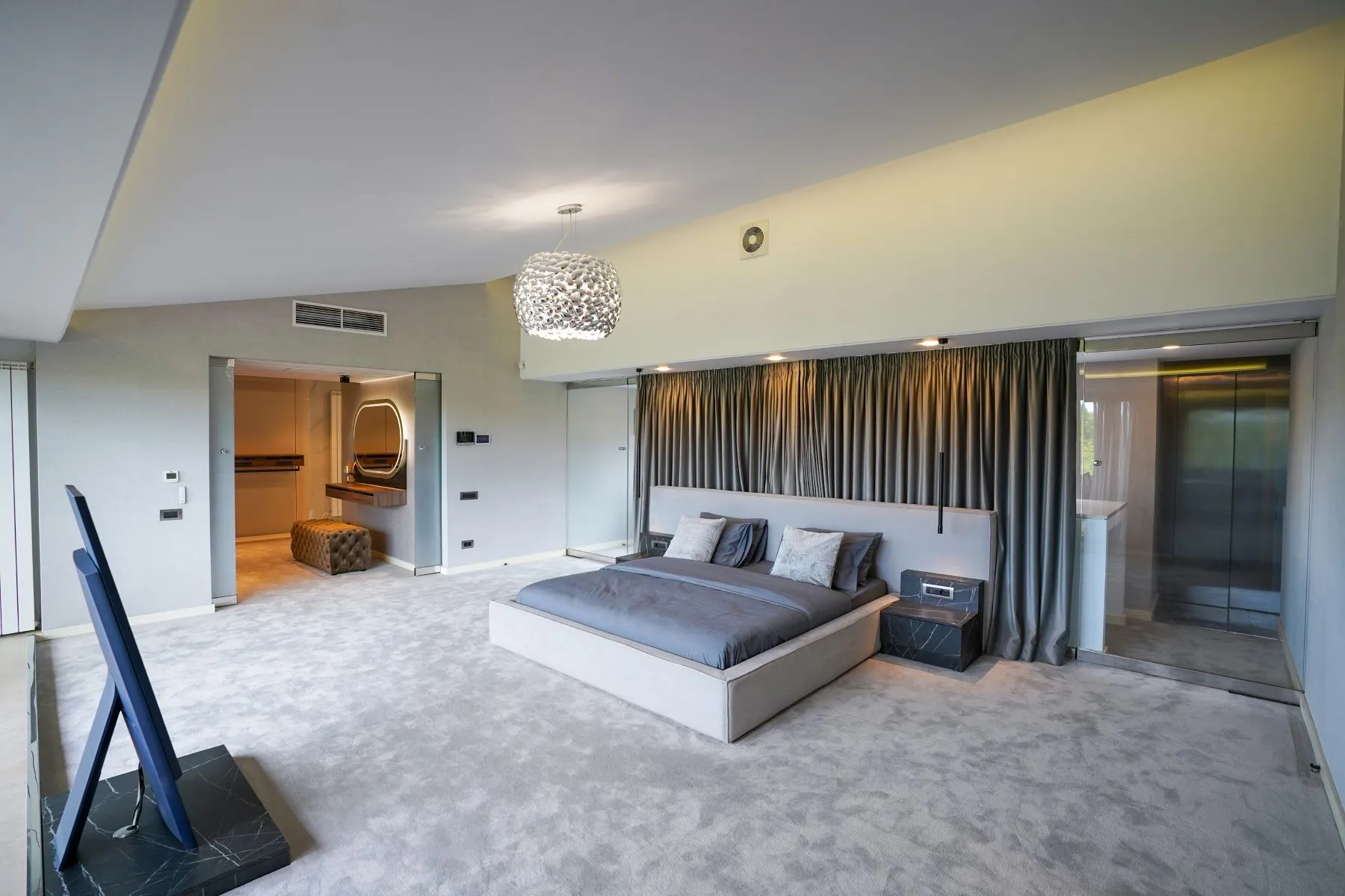 Generous principal bedroom with lake views and direct terrace access