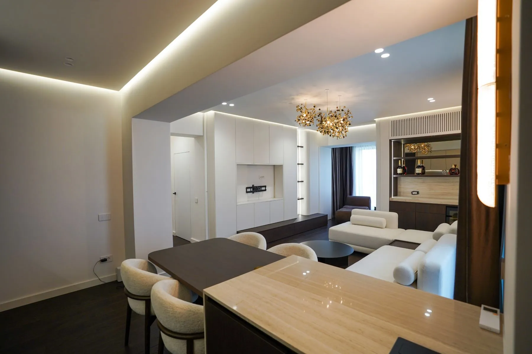 Designer dining table beside the lounge and decorative room divider