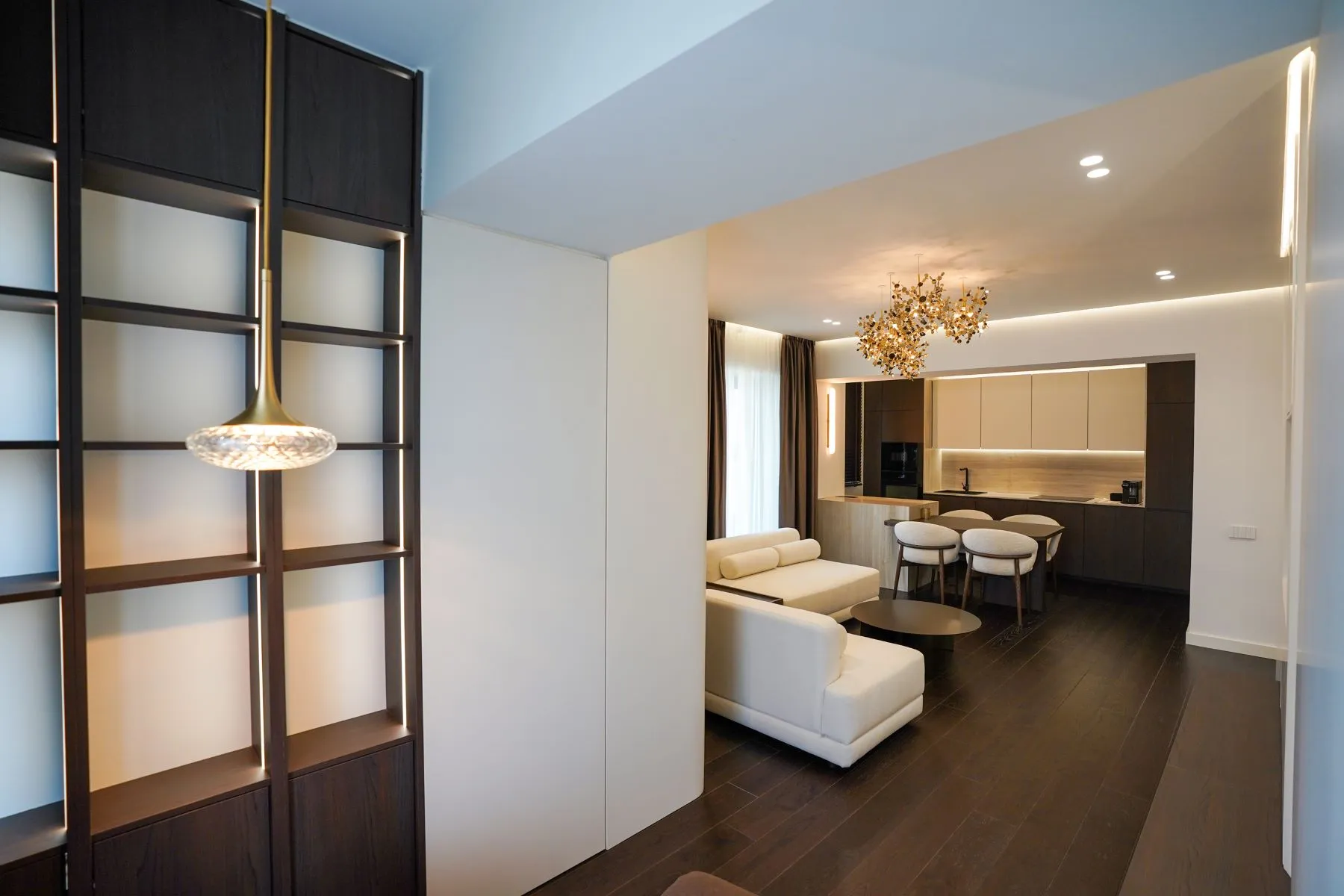Timber and glass partition framing the open-plan kitchen and living room