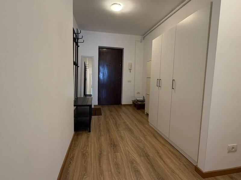 Entrance hallway with full-height built-in wardrobes and intercom