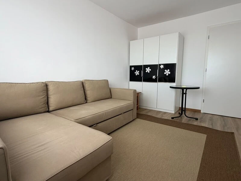 Second sitting and sleeping area with corner sofa and fitted wardrobe