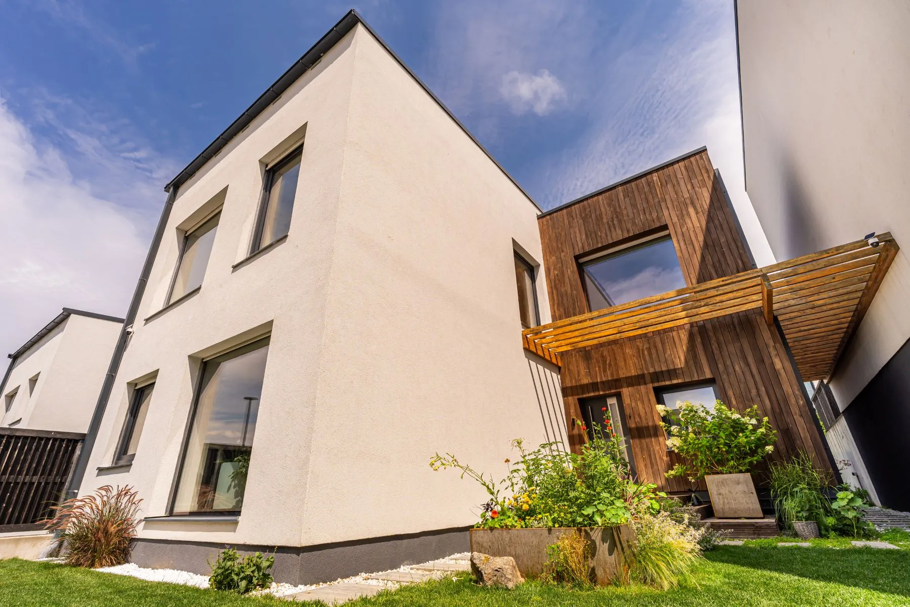 Contemporary SOL Residence villa with white render and natural timber cladding