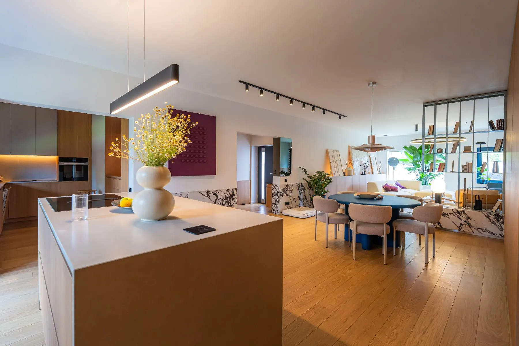Kitchen island overlooking the open dining and living space