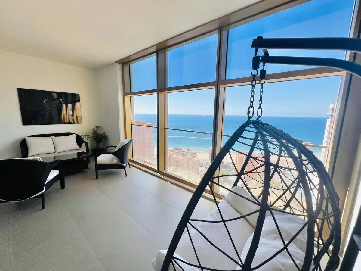 Private panoramic balcony with hanging chair and frontal sea views