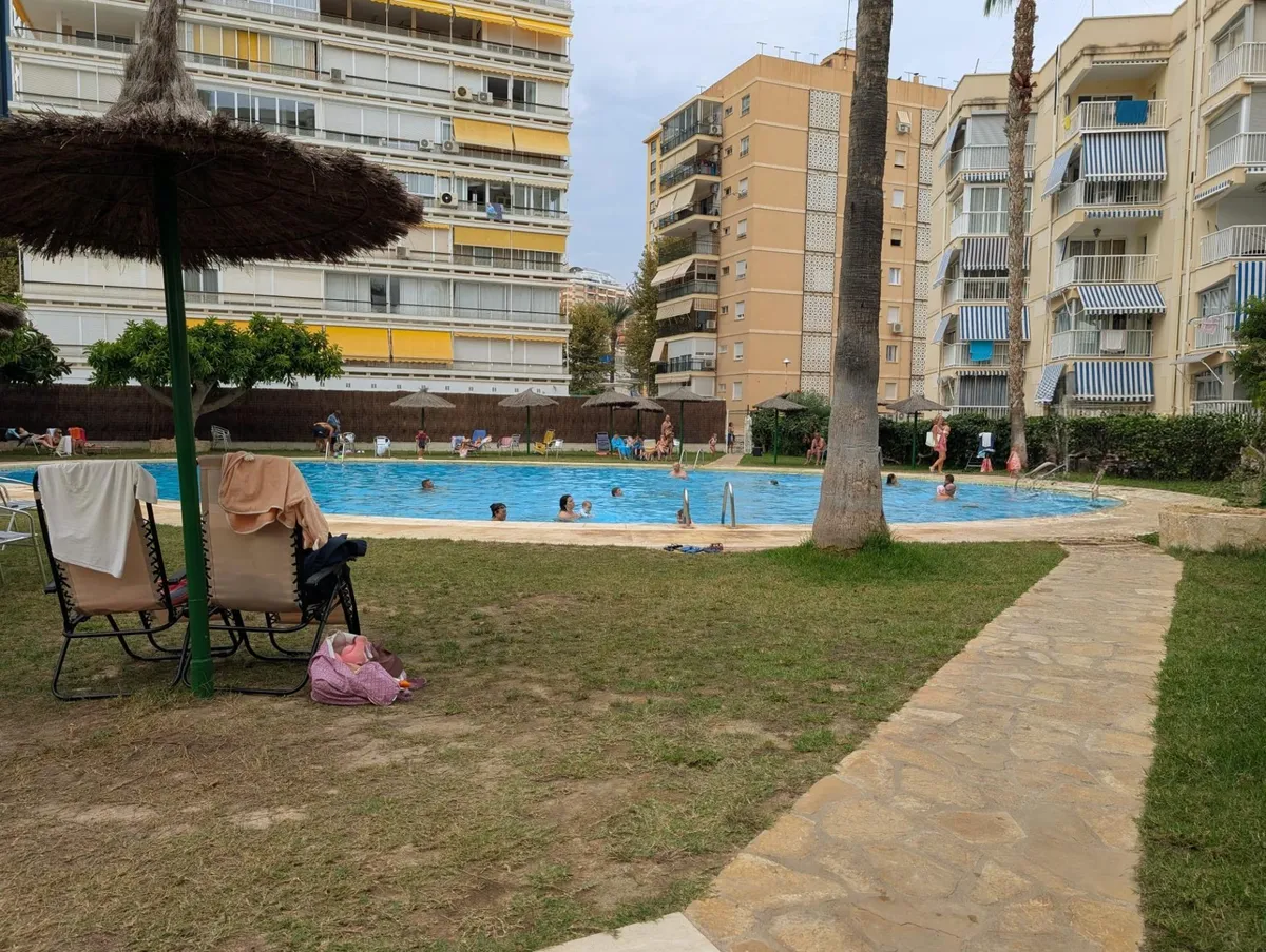 Communal swimming pool and garden within the beachfront development