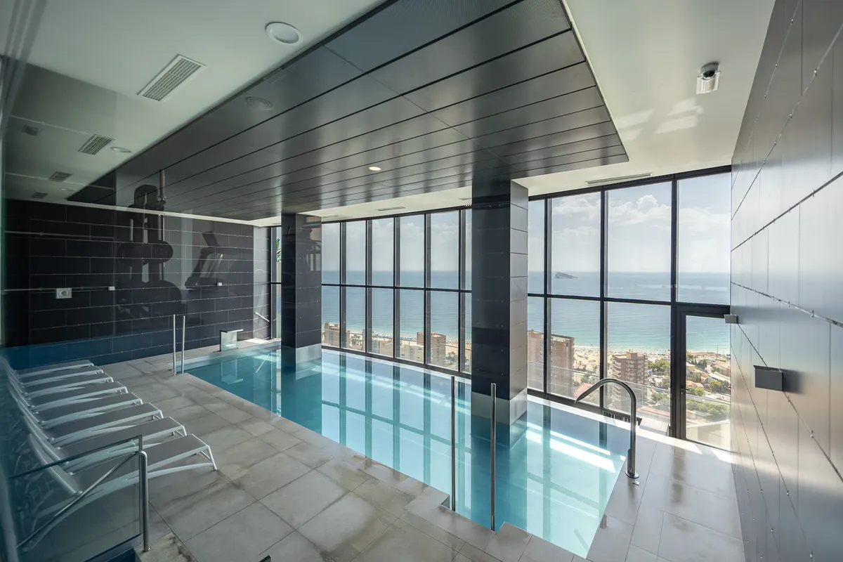 Heated indoor infinity pool with panoramic Mediterranean Sea views