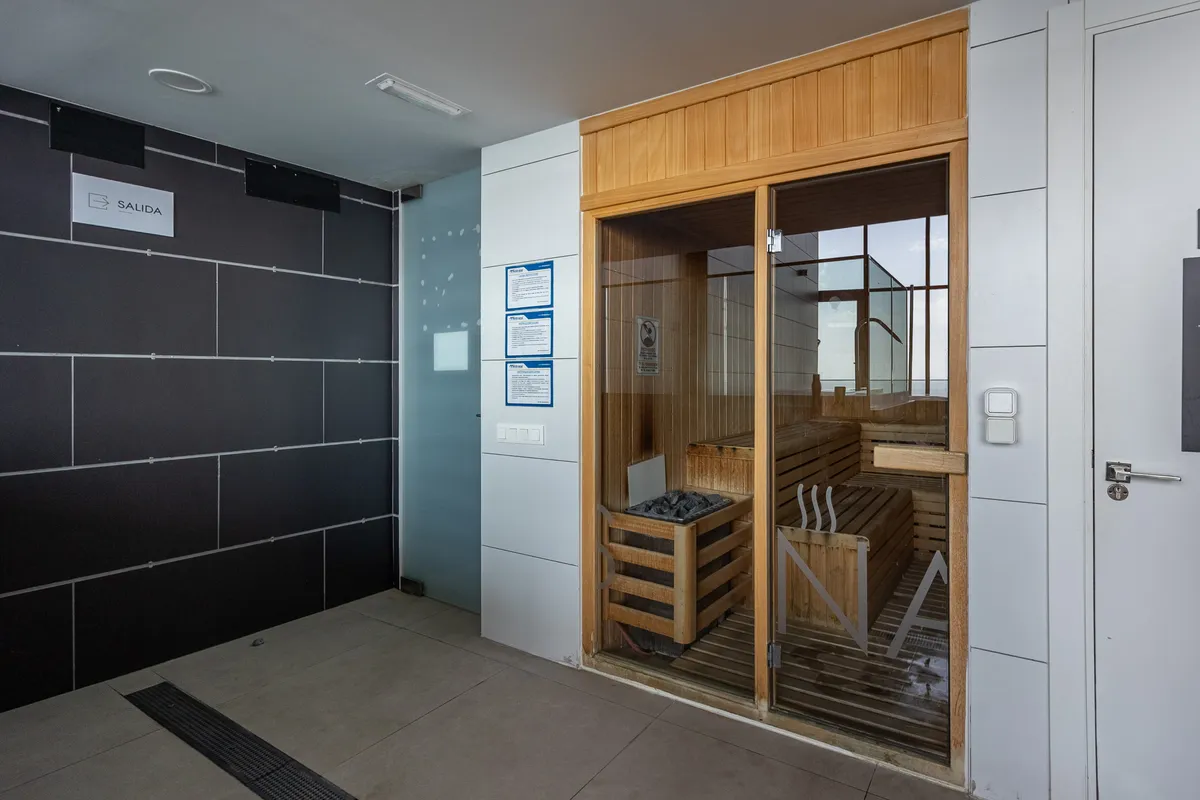 Timber sauna entrance within the development’s wellness area