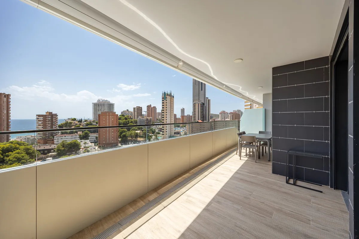 Spacious private terrace extending along the contemporary apartment