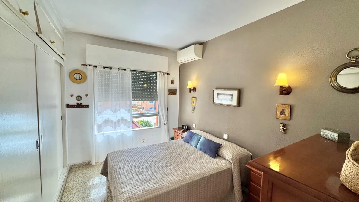 Bright double bedroom with fitted wardrobes and air conditioning