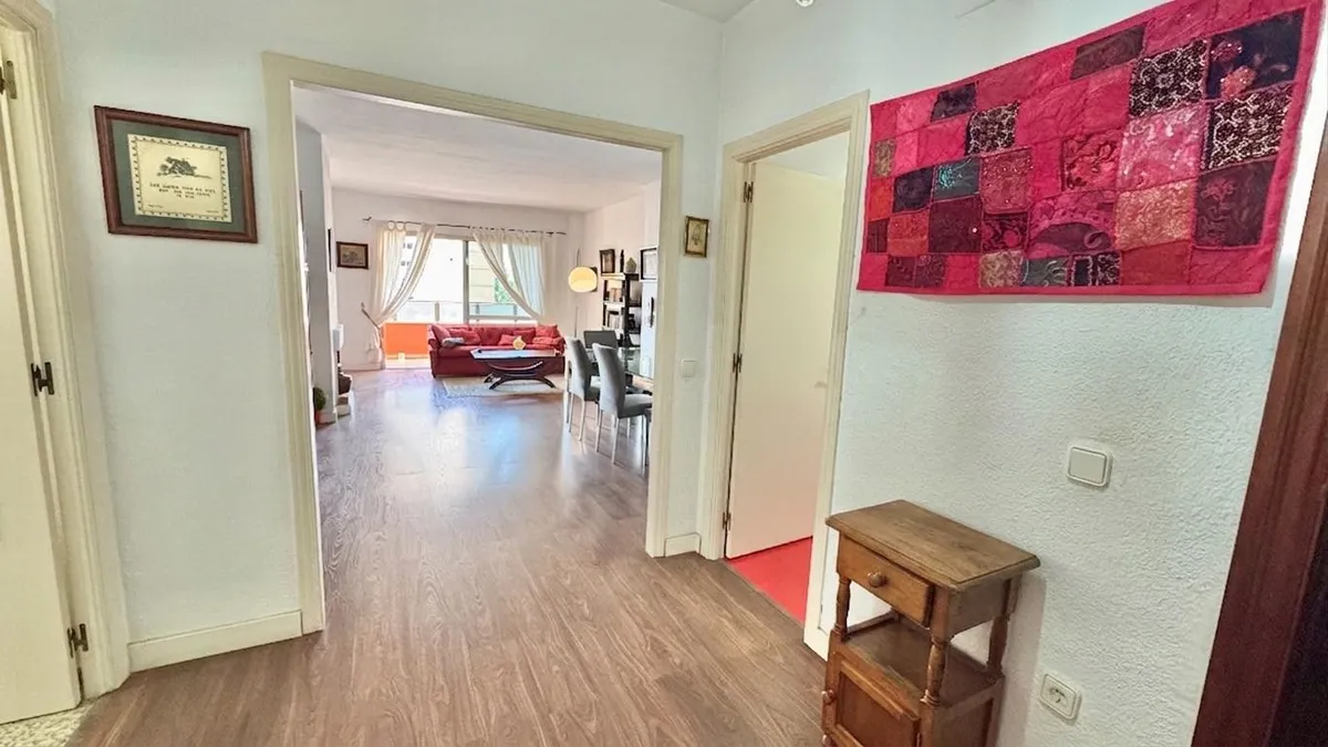 Entrance hallway opening into the spacious living and dining room