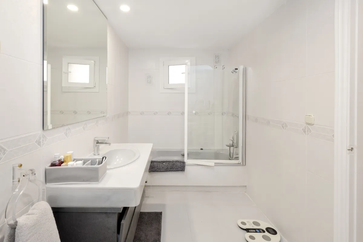 Bedroom corridor with polished marble flooring and storage cupboards