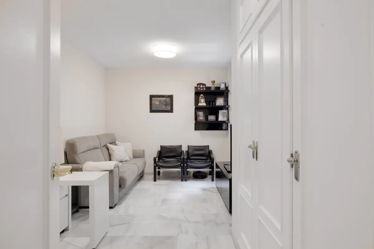 Kitchen entrance beside the breakfast area and patterned tiled floor